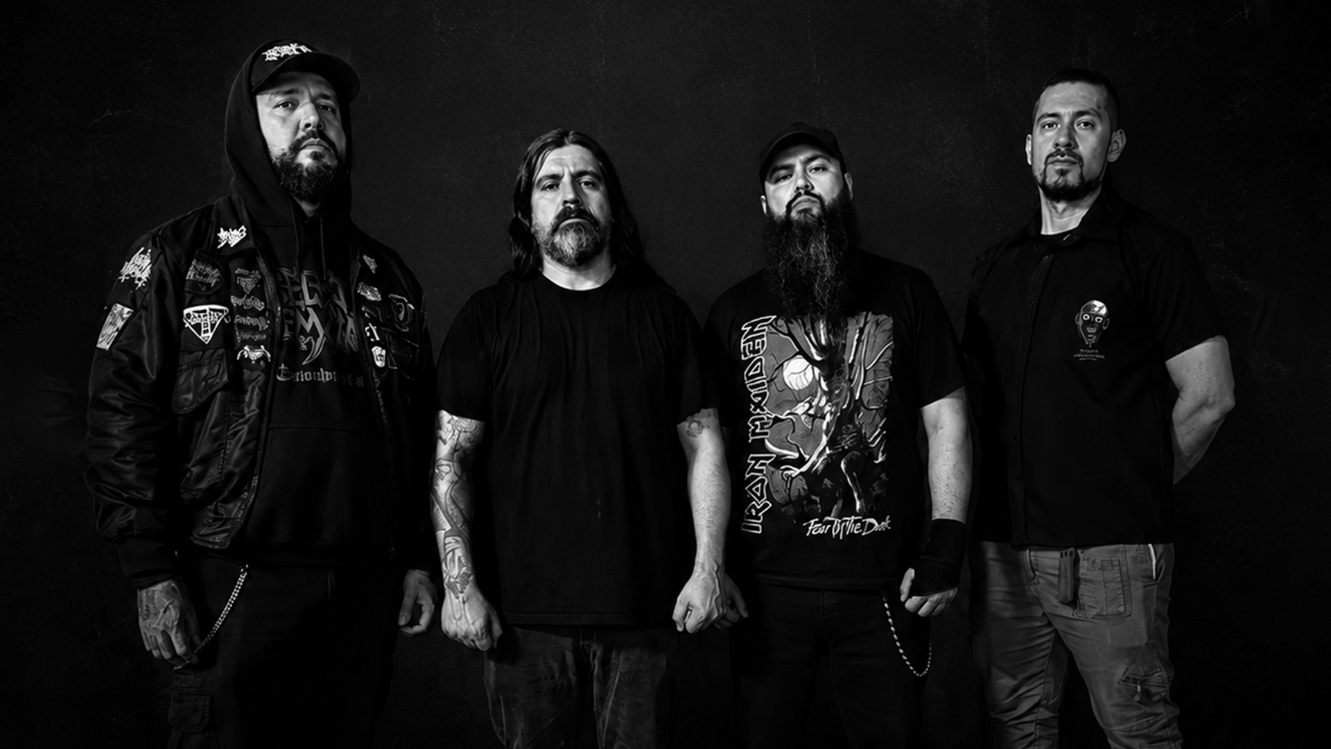 Deformity band members posing in black and white promo photo, 2026